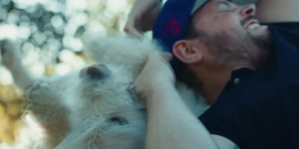 Mikael Lindnord hugs Arthur, the stray dog who followed his adventure racing team in Ecuador