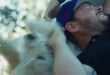 Mikael Lindnord hugs Arthur, the stray dog who followed his adventure racing team in Ecuador