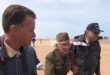 WWII veteran Robert Blatnik walking on Omaha Beach in Normandy in 2013