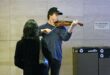 Joshua Bell playing violin in the L'Enfant Plaza Metro station in Washington, D.C.