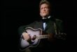 Johnny Cash plays guitar and sings Sunday Mornin Comin Down on The Johnny Cash Show