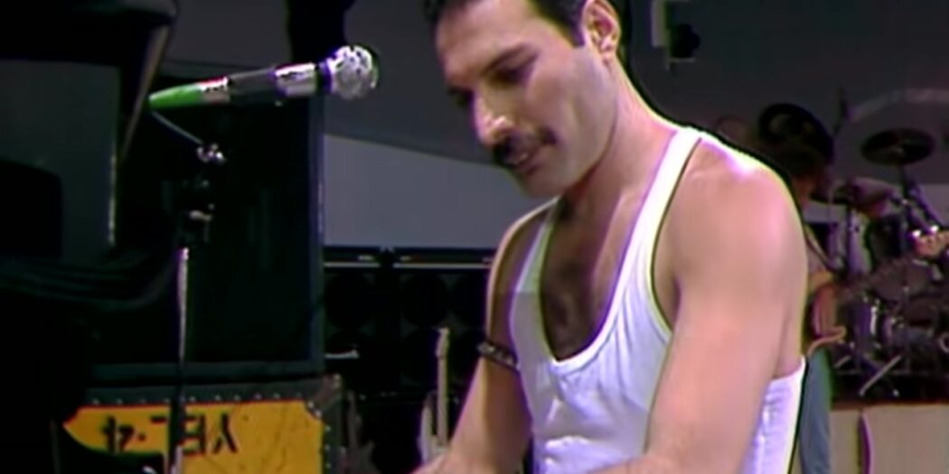 Freddie Mercury of Queen at the piano during Live Aid at Wembley Stadium in 1985