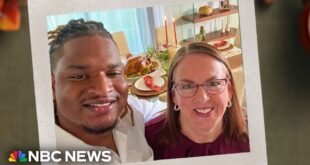 Wanda Dench and Jamal Hinton smiling together at Thanksgiving